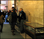 Inside the Arts Building Foyer: McGill faculty, students and staff gather around the University Archives' remembrance day display.