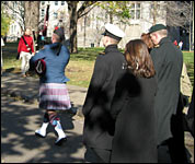 A piper leads the way to the Arts Building on a crisp but sunny November day.